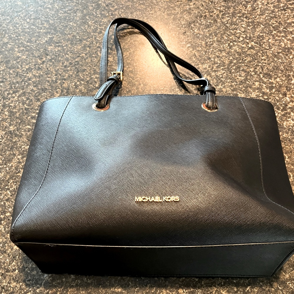 All Black Micheal Kors pocket book with computer holder